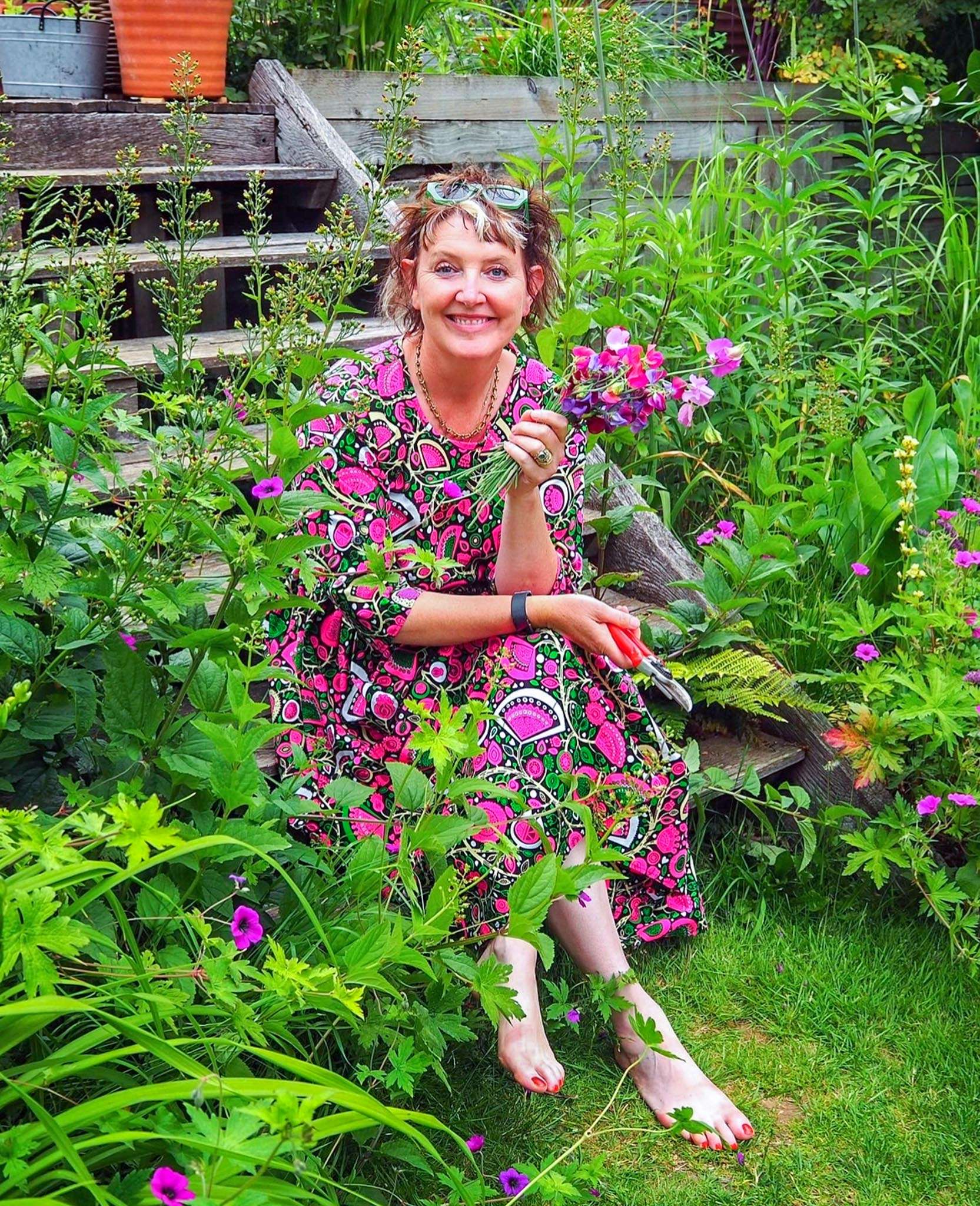 Ann-Marie Powell with her homegrown sweet peas in her Petersfield garden.
